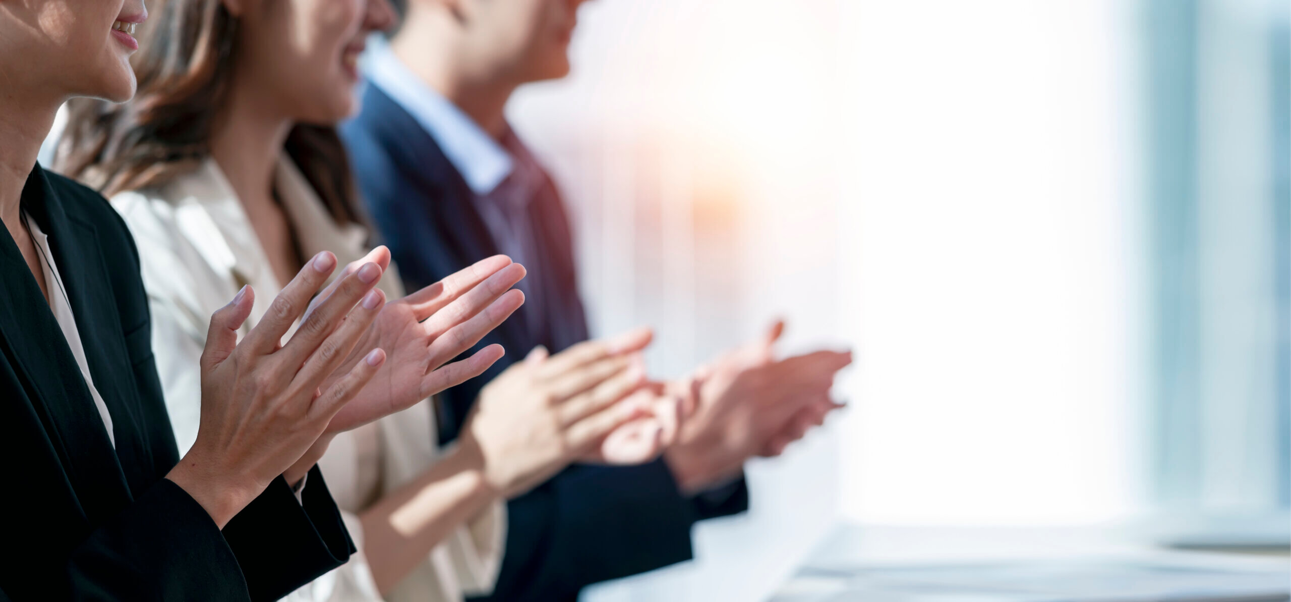Business people applauding.