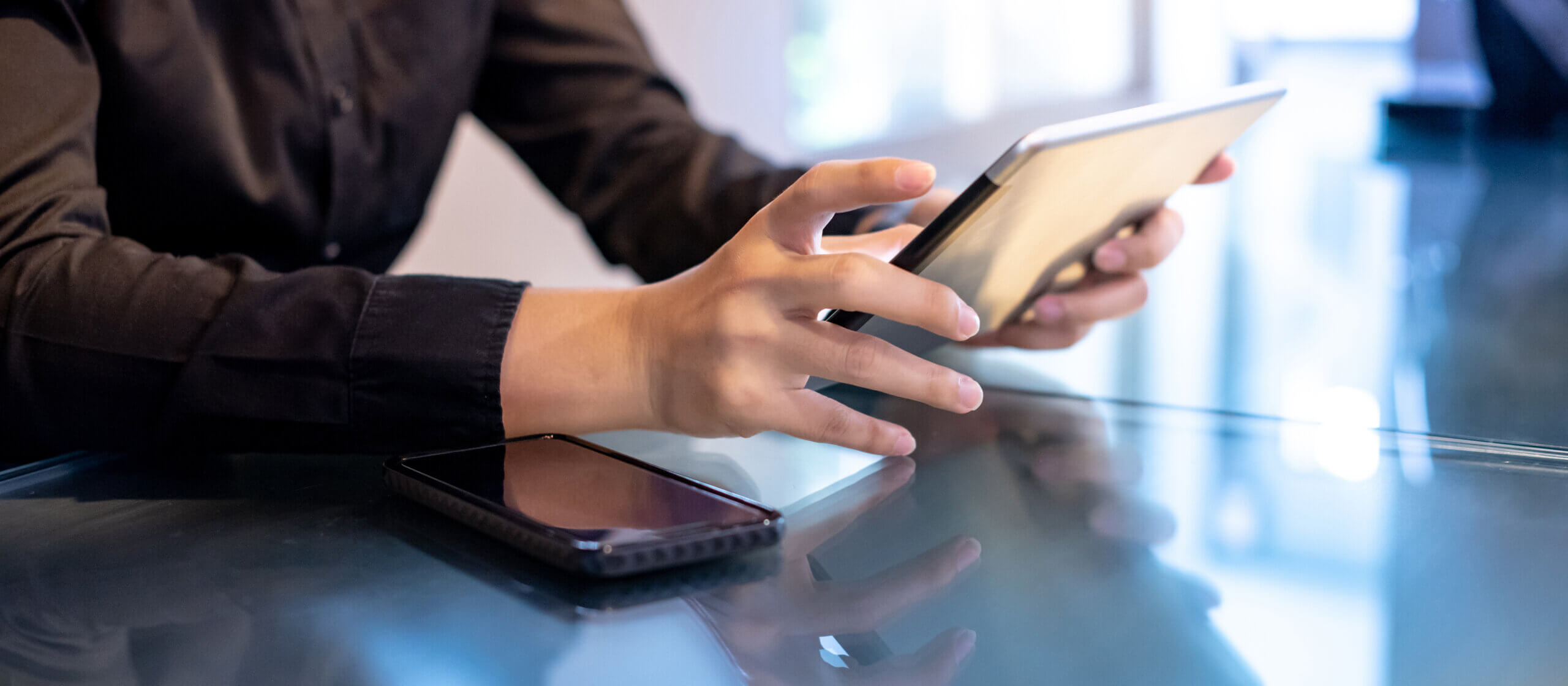 businessperson reading tablet.