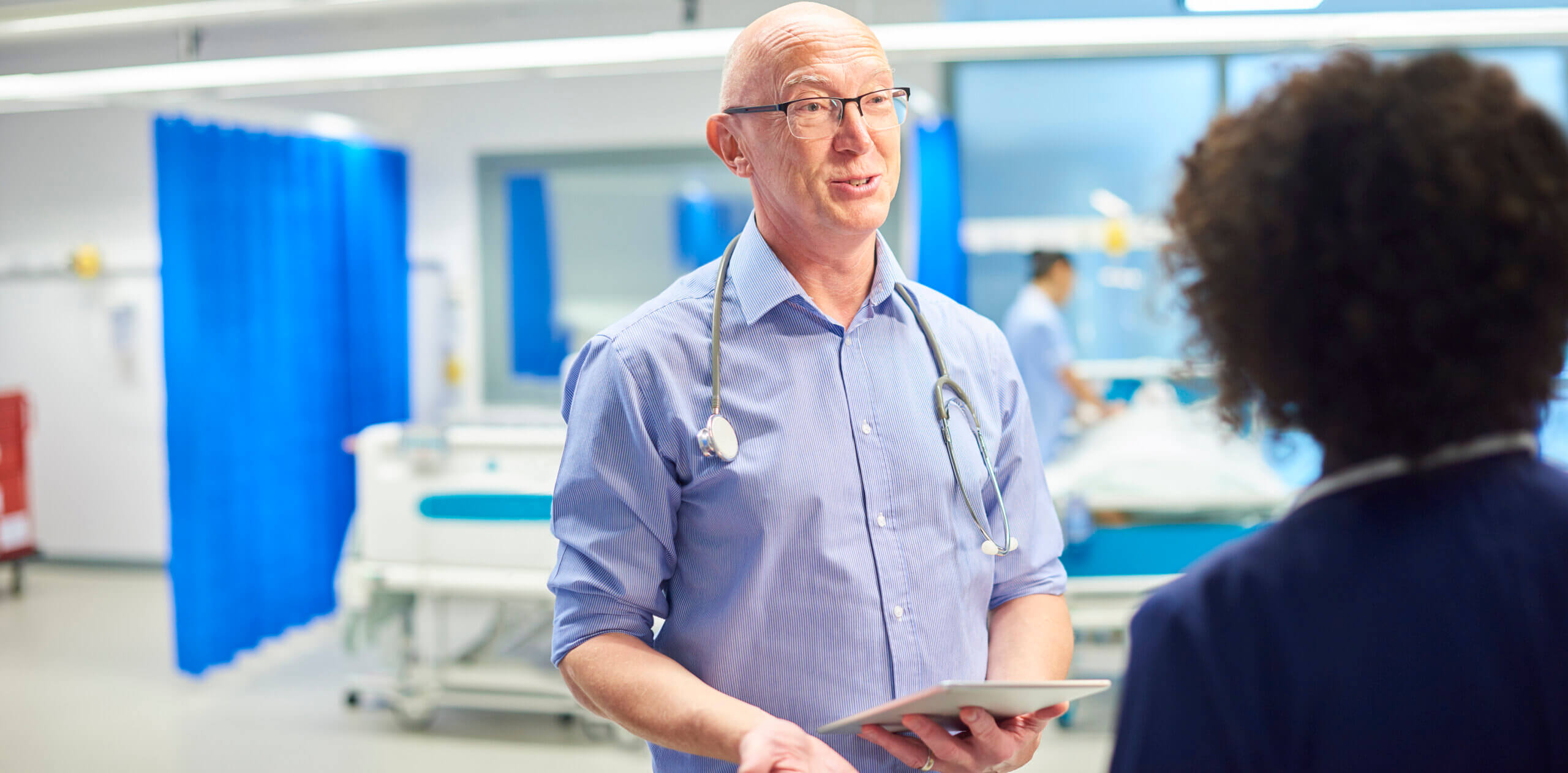 Doctor talking to nurse.