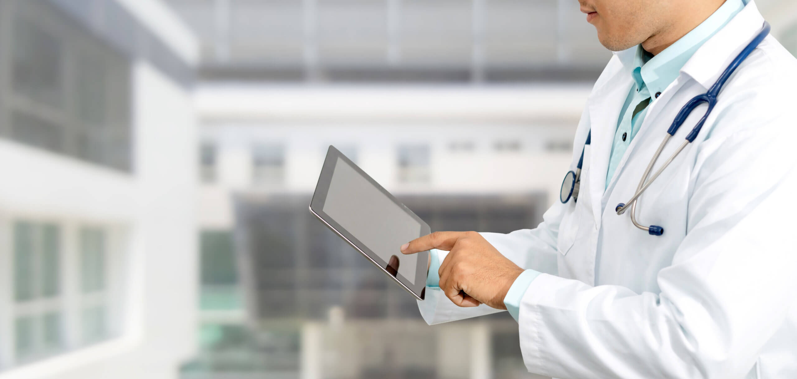 doctor reading tablet