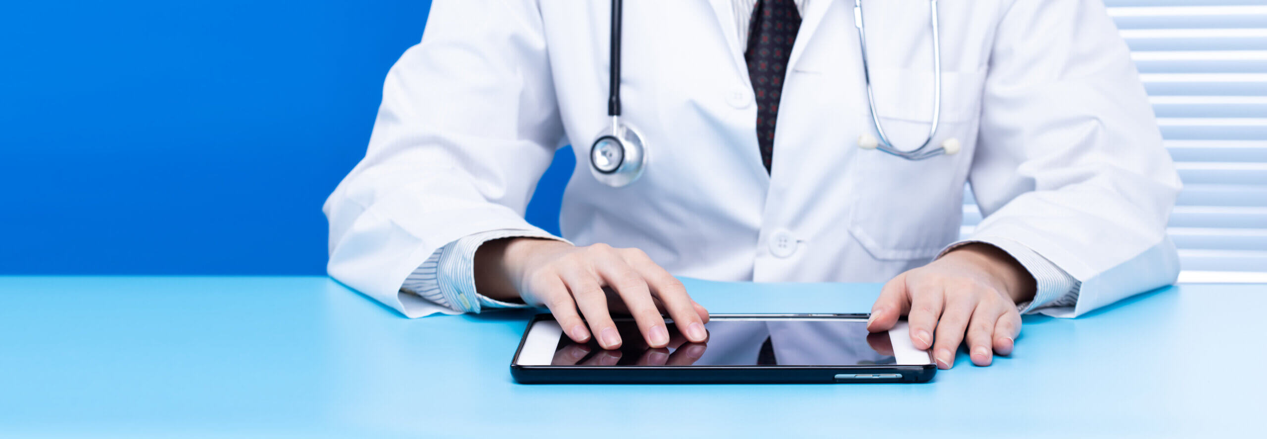 doctor reading tablet