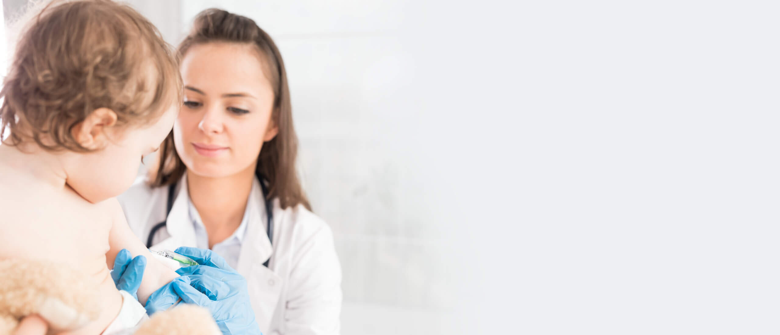 little girl receiving flu shot