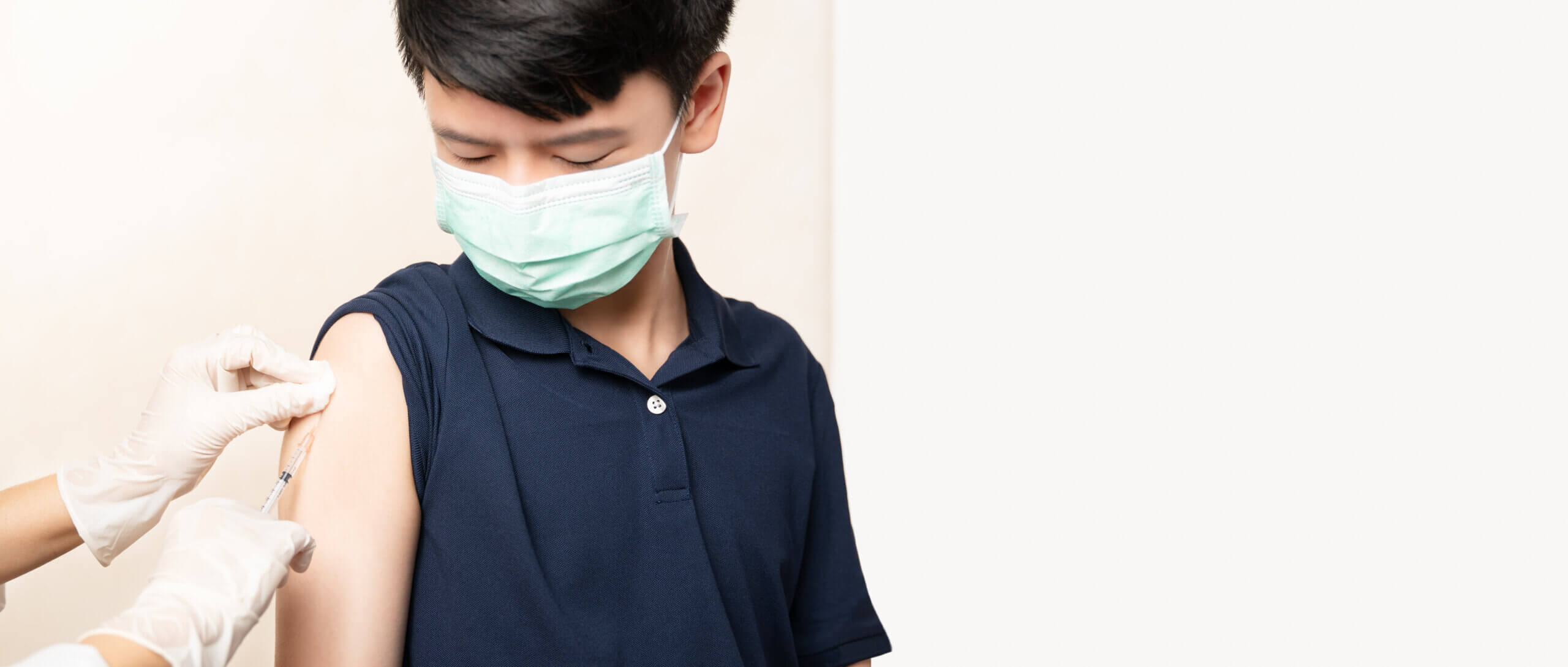 Child receiving covid vaccine.