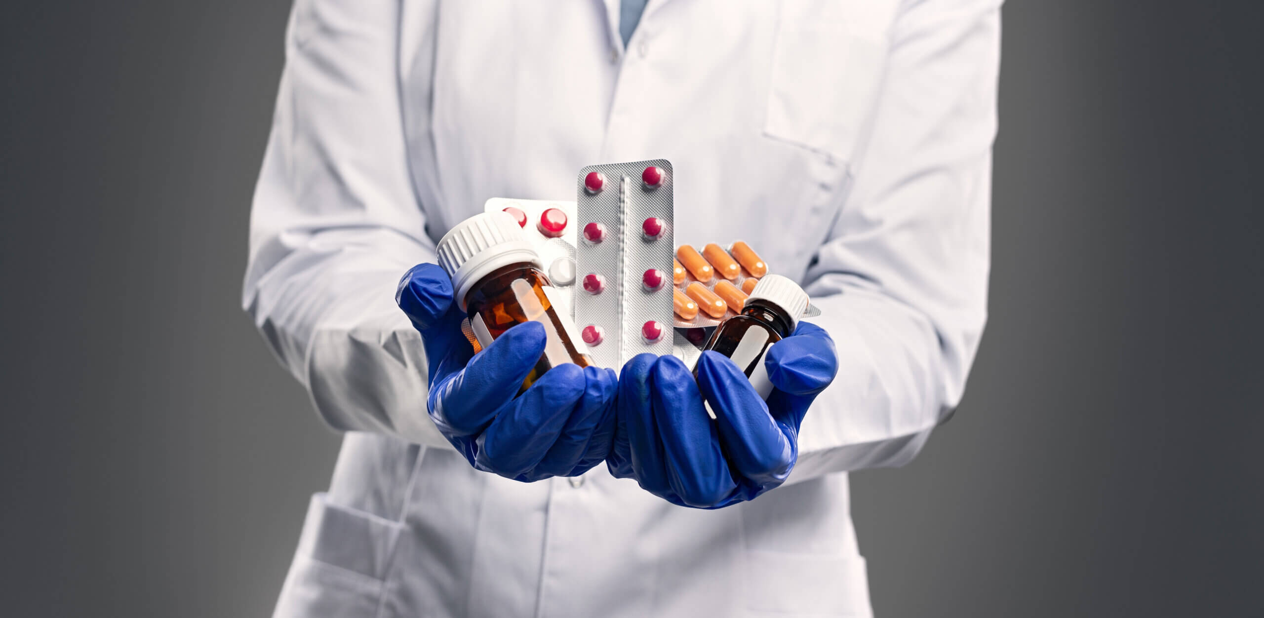 medical professional holding meds
