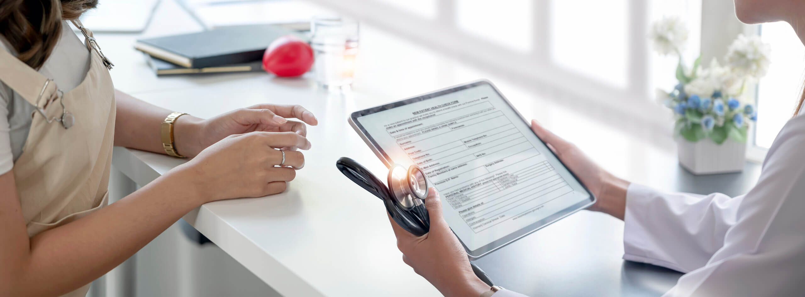 Doctor obtains digital consent from patient.